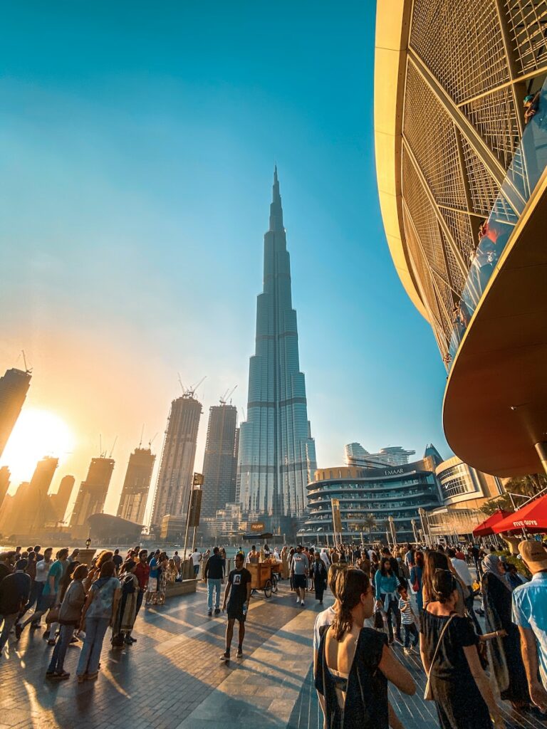 people walking on street near high rise buildings during daytime